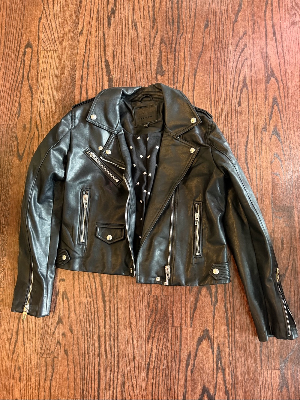 Blank NYC Black Faux Leather Moto Jacket with Star Lining